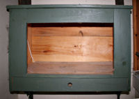 Seed-starting cabinet with holder for materials