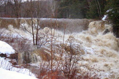 Water overtops our dam on the Cox Brook